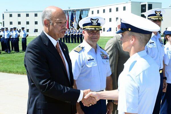 U.S. Department of Homeland Security Secretary Jeh Johnson congratulates a Coast Guard recruit at graduation July 31