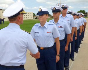 Commandant Adm. Paul Zukunft shakes hands with Seaman Apprentice Autumn Lee