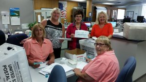 County Clerk Rita Marie Fulginiti (center) with Election Clerks Jane Rusco (standing  left)