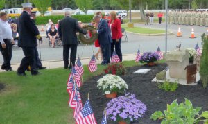 County Ceremony. Freeholders and first responders place wreath by county's Sept. 11 memorial at County Administration Building.