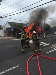 Firefighters Extinguish Truck Fire