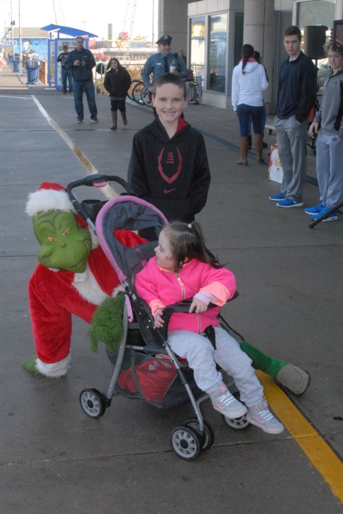 Hannah and Sean Parchesky with the Grinch.