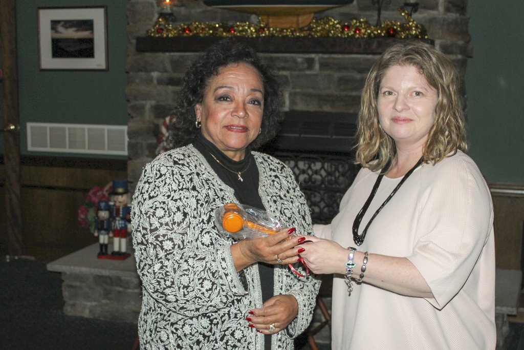 Lynne Dubler passes the gavel on to Marie Sluberski at the Cape Regional Medical Center Auxiliary's installation of 2016-2017 officers.