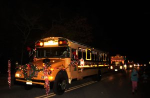 Dennis Township buses decked with garland and wreaths cheered and tossed out candy to the crowd.