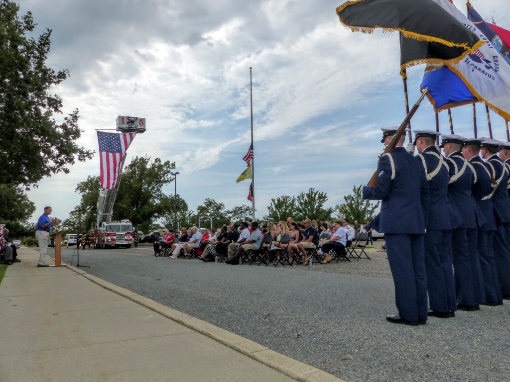 U.S. Rep. Frank LoBiondo (R-2nd) addresses crowd at Patriot Day ceremony at Cape May County Administration Building Sept. 11 as Coast Guard Training Center Ceremonial Detail holds flags