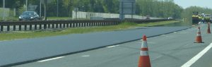 File photo. Construction crew takes advantage of balmy weather May 12 to pave part of the southbound lane of Garden State Parkway.