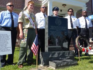 Boy Scout Colby Schalek with Woodbine firefighters by his Eagle Scout project