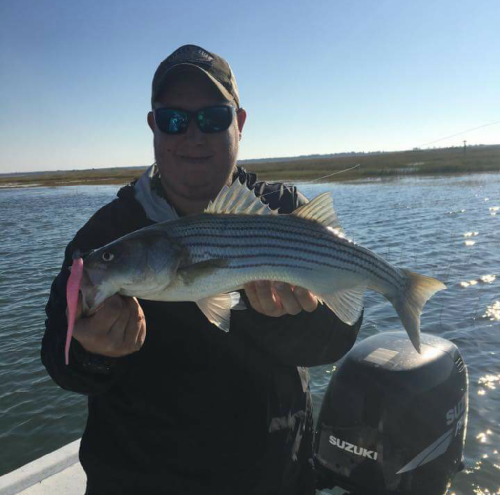 Cameron and an early morning Striper.