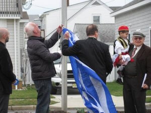 Raising the Greek flag.