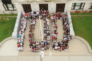 Wildwood High School's 2016 graduating seniors form a "100" in honor of the building's centennial.