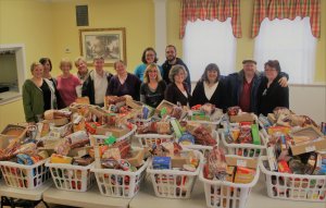 Twenty-four food baskets are assembled and delivered to families needing a helping hand just in time for Thanksgiving.