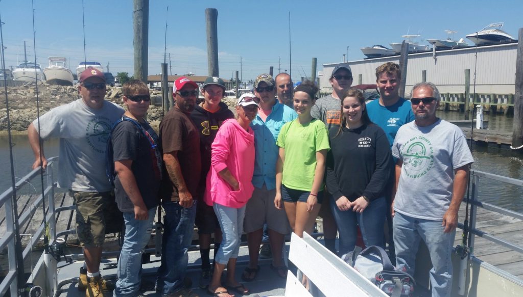 Tightlines 4-H Fishing Club gather for a picture following their annual Father’s Day fishing trip on the Family Fisherman.