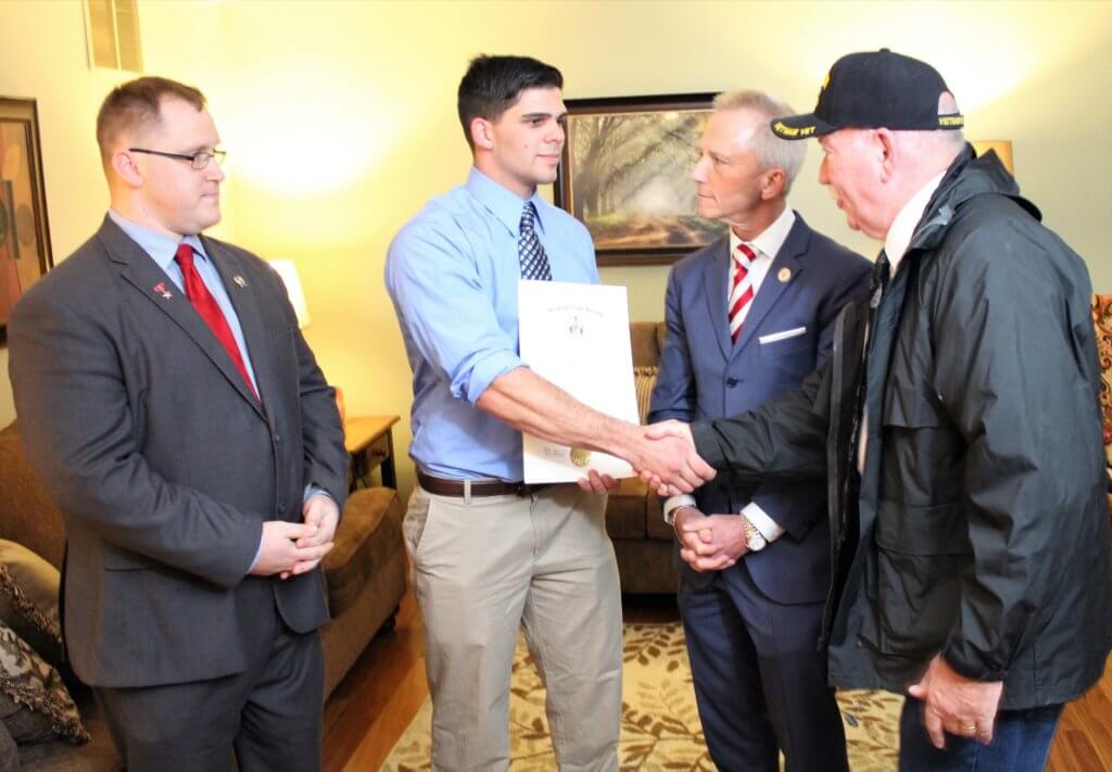 Sgt. Thomas Daniels receives proclamation upon his return home serving in Afghanistan in the Army. From left