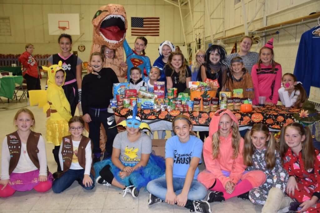 Local Girl Scouts collected hundreds of canned goods this fall to donate to Cape families in need.  