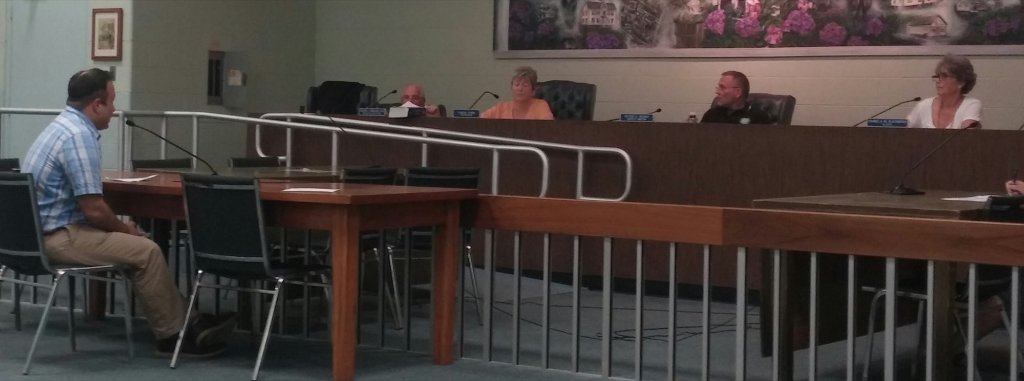 Willow Creek Winery Farm Director Kevin Celli addresses the West Cape May Board of Commissioners June 22 during a public hearing to borrow funds for payment between the parties. In the background are Solicitor Frank Corrado