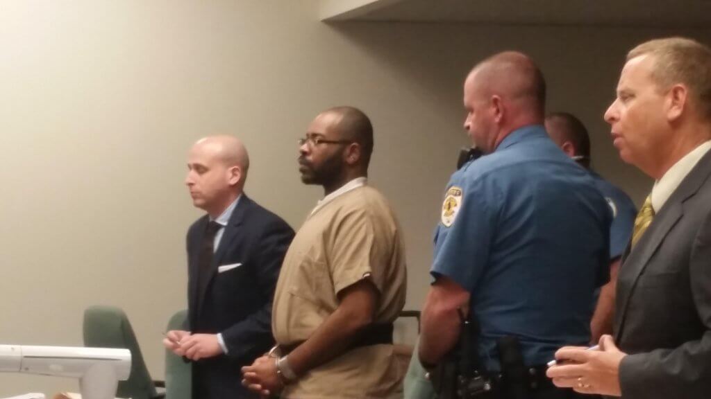 Charles Mosley stands before Superior Court Judge John Porto April 15.