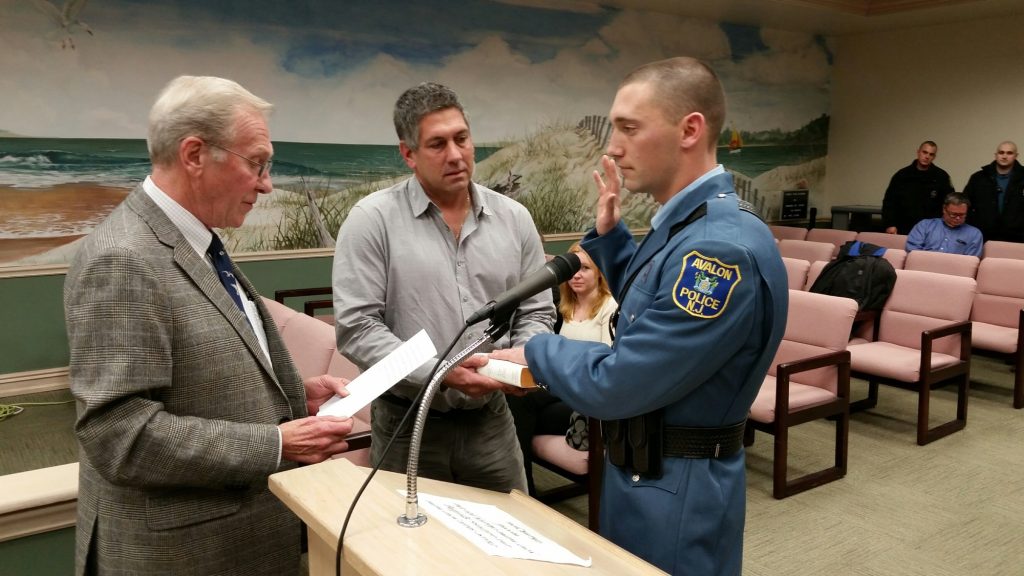 Avalon Mayor Martin Pagliughi administers oath to Police Officer Matthew Ardelean as his grandfather