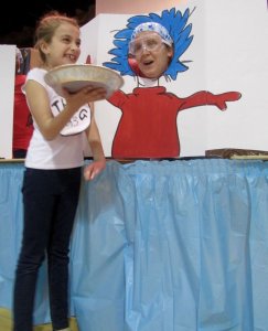 MaKenna Flemming gets ready to pie third-grade teacher Mikenzie Helphenstine.