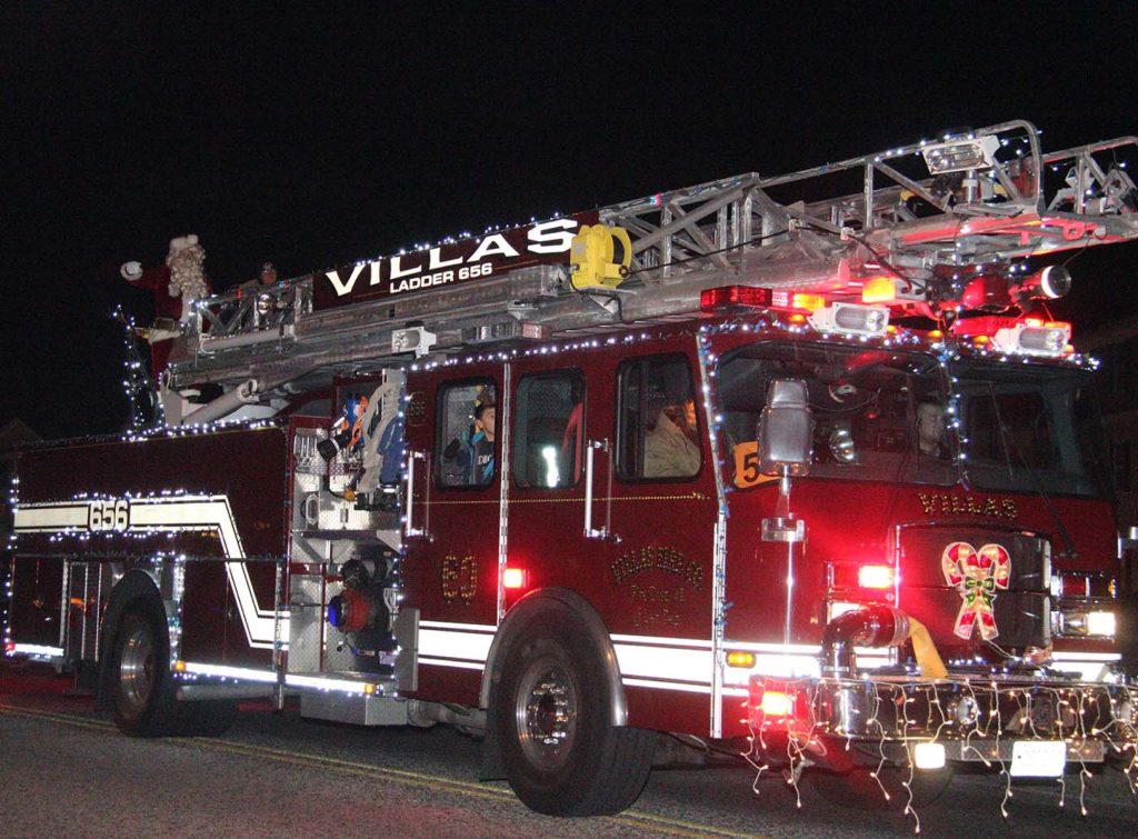 Santa Claus rides on the Villas Fire Truck on Bayshore Road in North Cape May Dec. 10