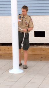 Eagle Scout David Laverty prepares to lower the flag at Ocean City American Legion Post 524.