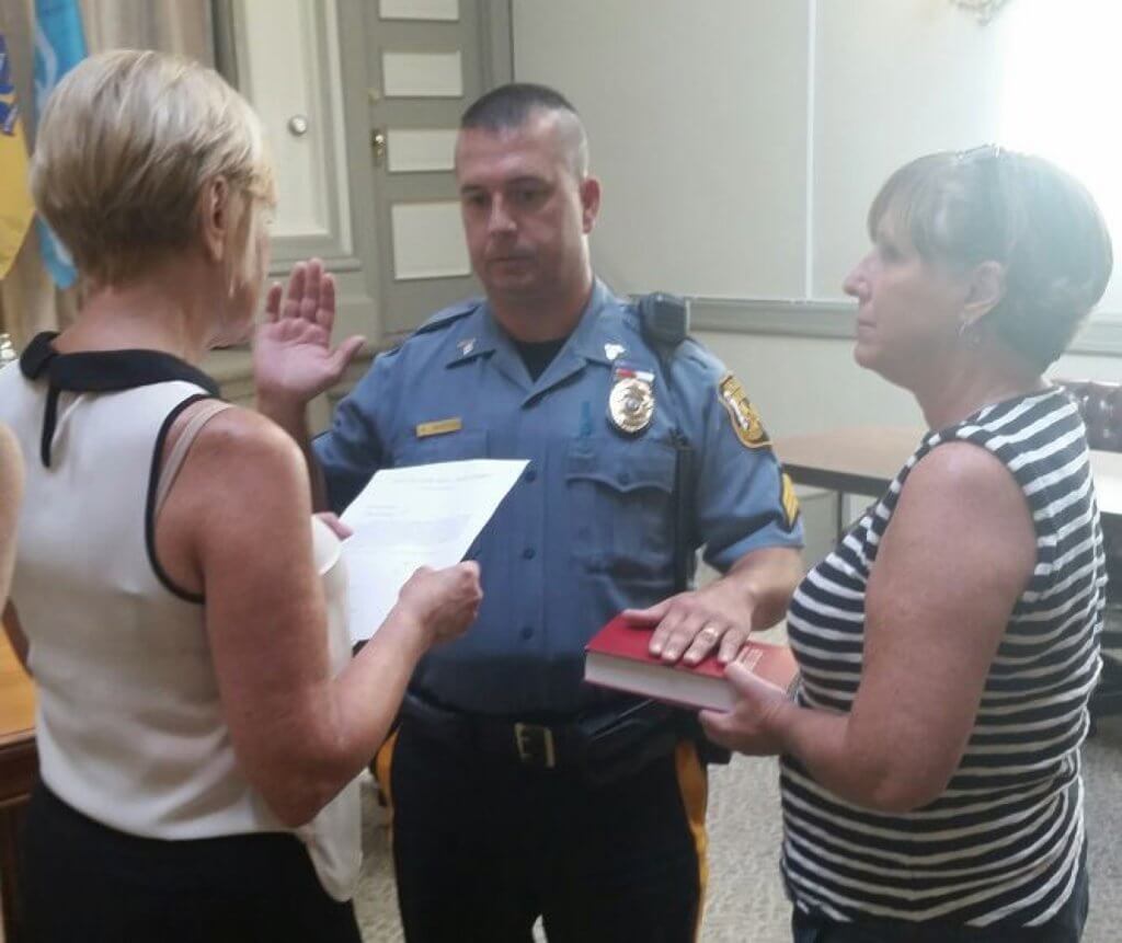 Sgt. Anthony Marino takes the oath as Cape May chief of police Aug. 15 as his wife Barbara holds the Bible. Administering the oath is City Clerk Louise Cummiskey. 