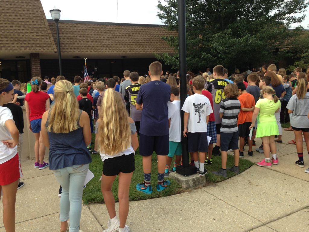 Students from Upper Township Middle School listen to a ceremony remembering the more than 3