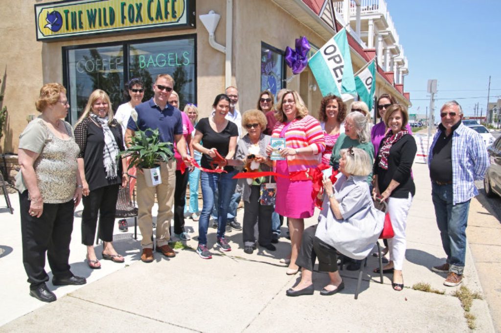 North Wildwood Mayor Rosenello looks on as Kate Trivelis cuts the ribbon. 