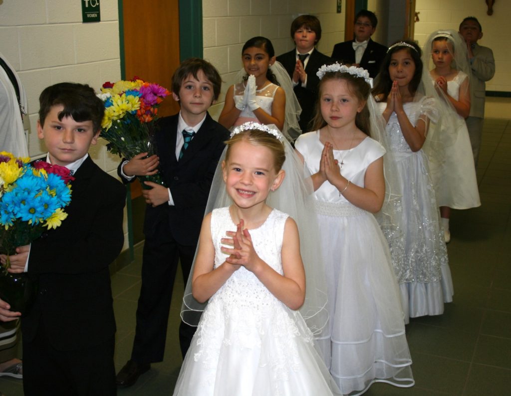 Second graders who made Holy Communion this year are lined up