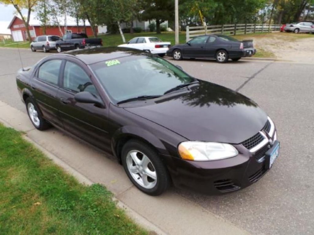 2004 black Dodge Stratus similar to vehicle of accused.