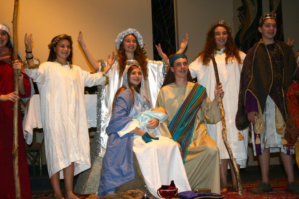 Bishop McHugh 8th graders retell the story of Christmas. From (L to R) are: (standing) Emily Holzer