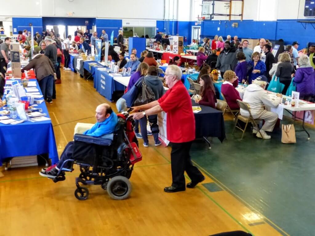 Avalon Community Hall was the site of the county’s Eighth Annual Disabilities Awareness Day Nov. 5. Peter Gilson of Woodbine takes Patrick O’Connor of Court House to see various exhibits. Music was provided by Cape May County String Band.
