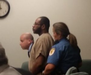 Charles Mosley stands before Superior Court Judge John Porto Aug. 18.