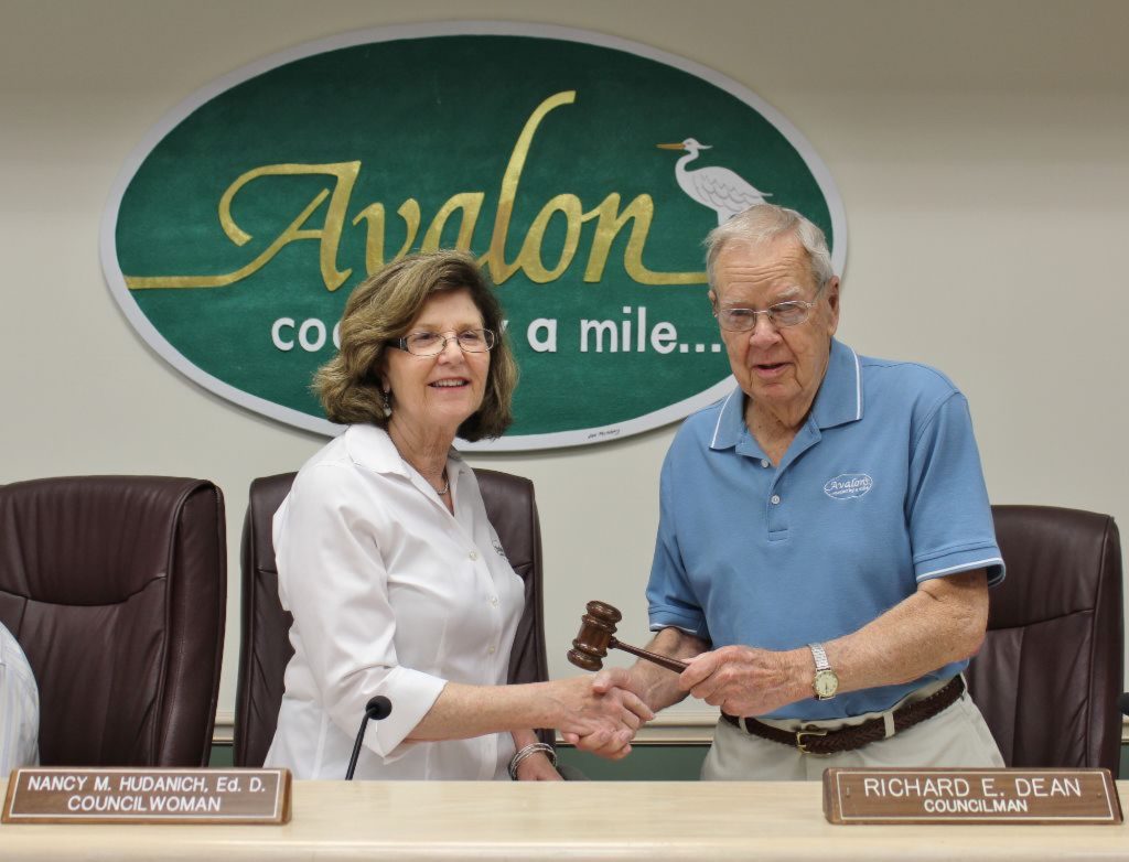 Council President Nancy Hudanich accepts gavel from former Council President Richard Dean.