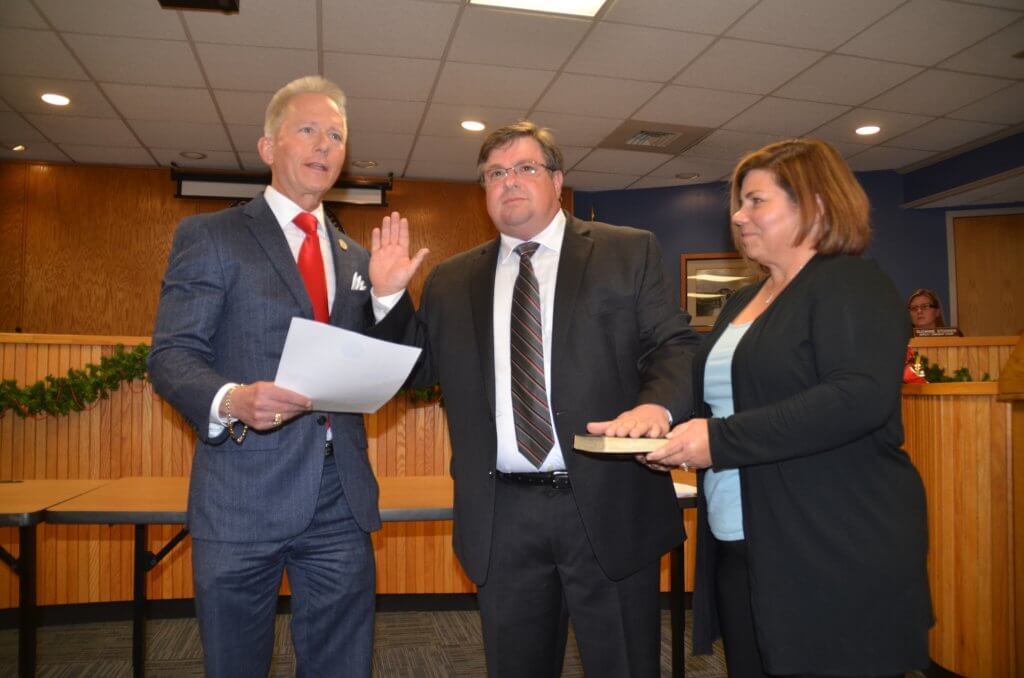 Middle Township Committeeman Jeffrey DeVico takes oath to start his first term Jan. 4 from Sen. Jeff Van Drew (D-1st). Holding Bible is Michelle Devico