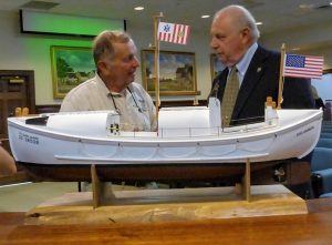 A scale model of a 36-foot Coast Guard wooden motor lifeboat with Kevin Maloney