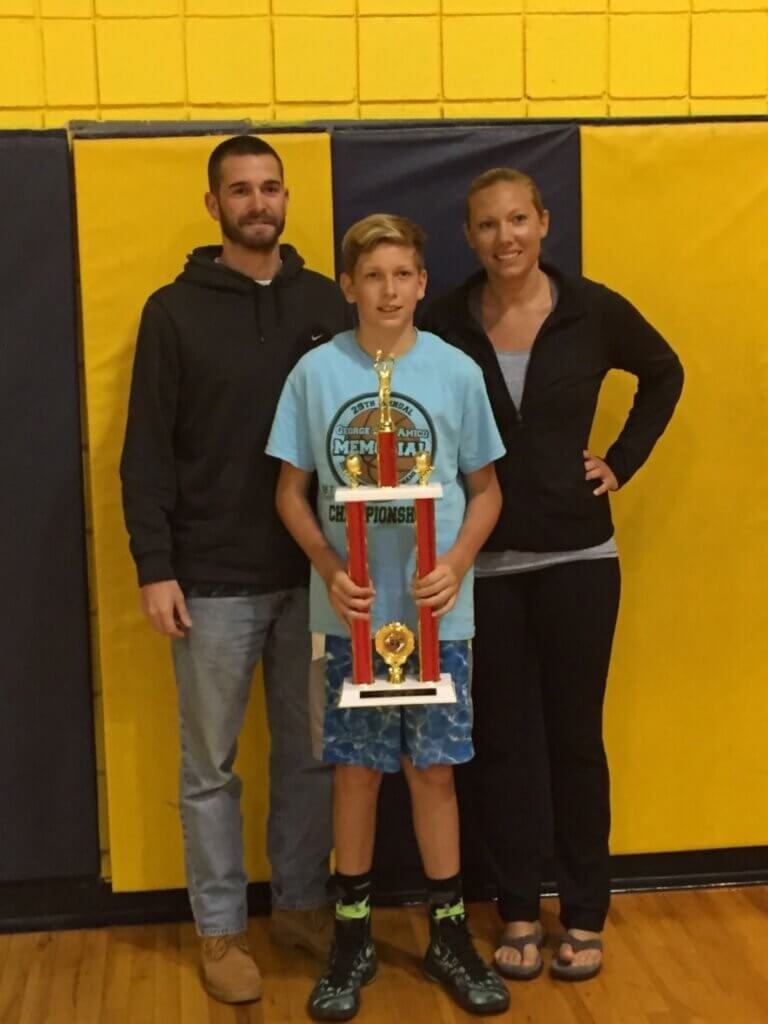 Keith is a seventh grade student at Bishop McHugh. He is pictured here with his parents