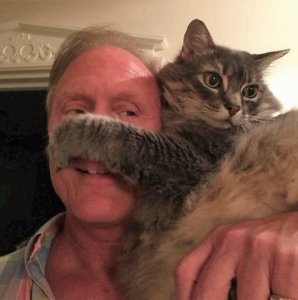 Ken Strain and his beloved cat Baxter host an animal fundraiser