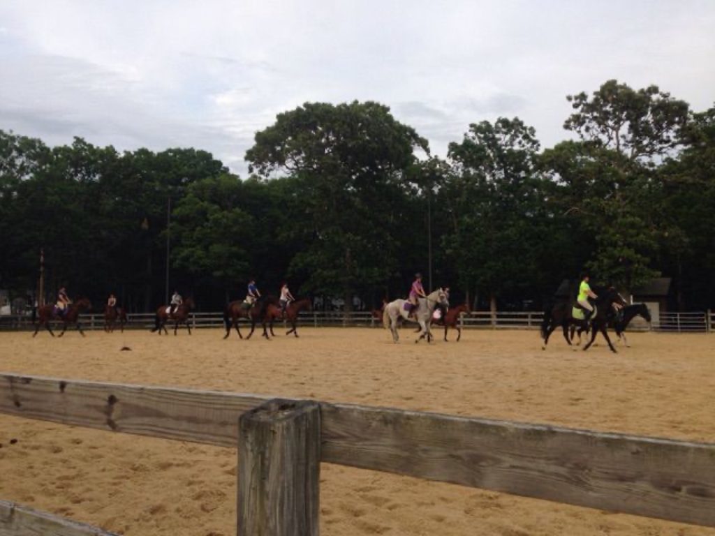 Moonlight Riders 4-H Mounted Drill Team captains Annabella Halbruner and Rachel Coulter lead their fellow team members through a practice run of their choreographed performance.