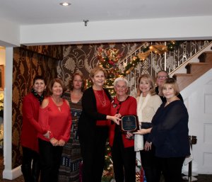 Plaque being presented to Soroptimist members Mary Rose Bispels