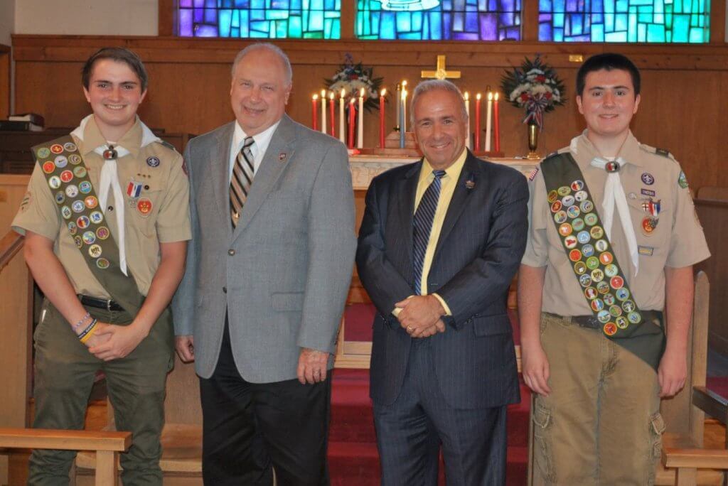 Eagle Scouts Jacob Gibson (far left) and William Poole are shown during their Court of Honor on June 11 with Cape May County Freeholder Director Gerald Thornton (second from left) and Freeholder Vice-Director / Sea Isle City Mayor Leonard Desiderio.