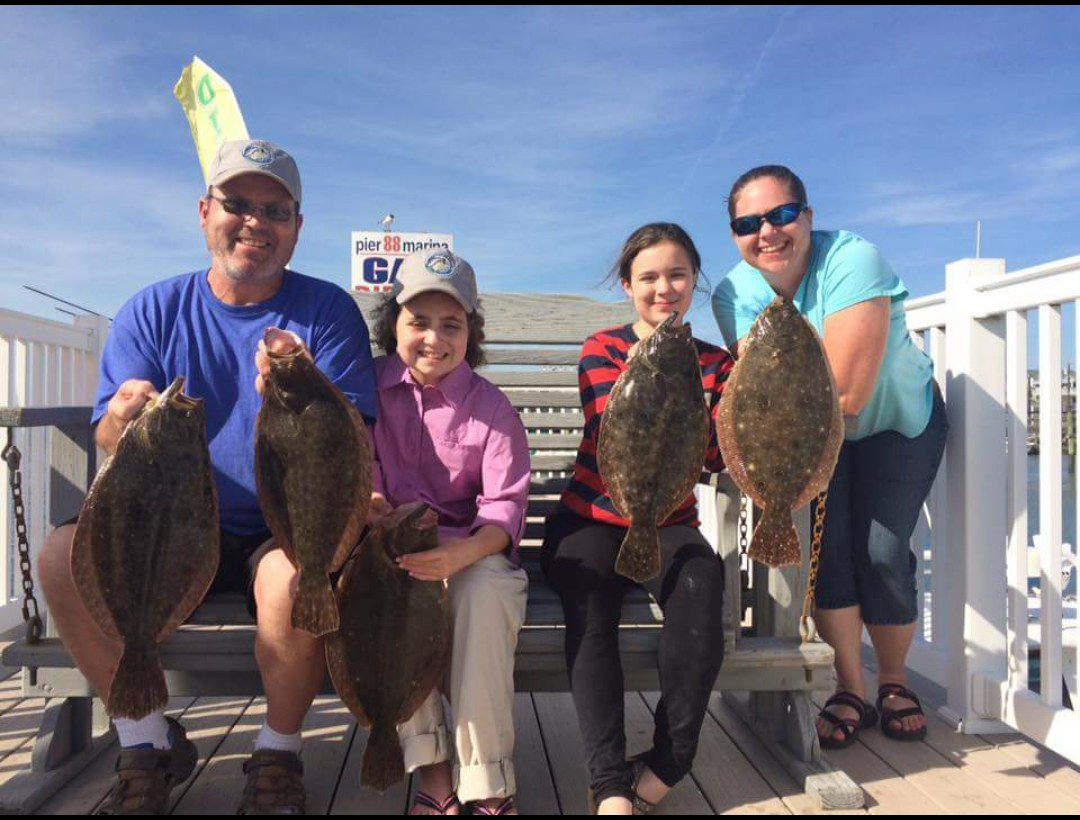 The Rodgers family and their “flat fish” haul. 