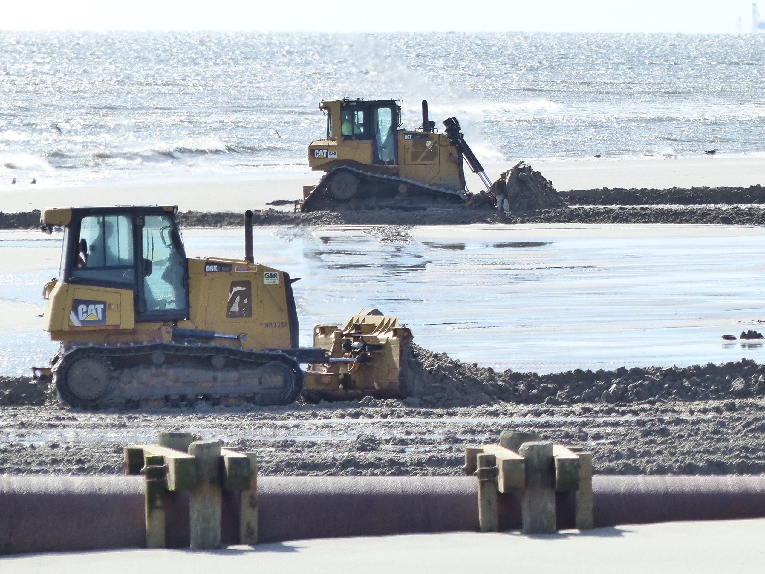 Bulldozers push sand from water line into the dune near Third Avenue and JFK Boulevard Feb. 10. The dunes were ravaged by the Jan. 23 nor'easter.