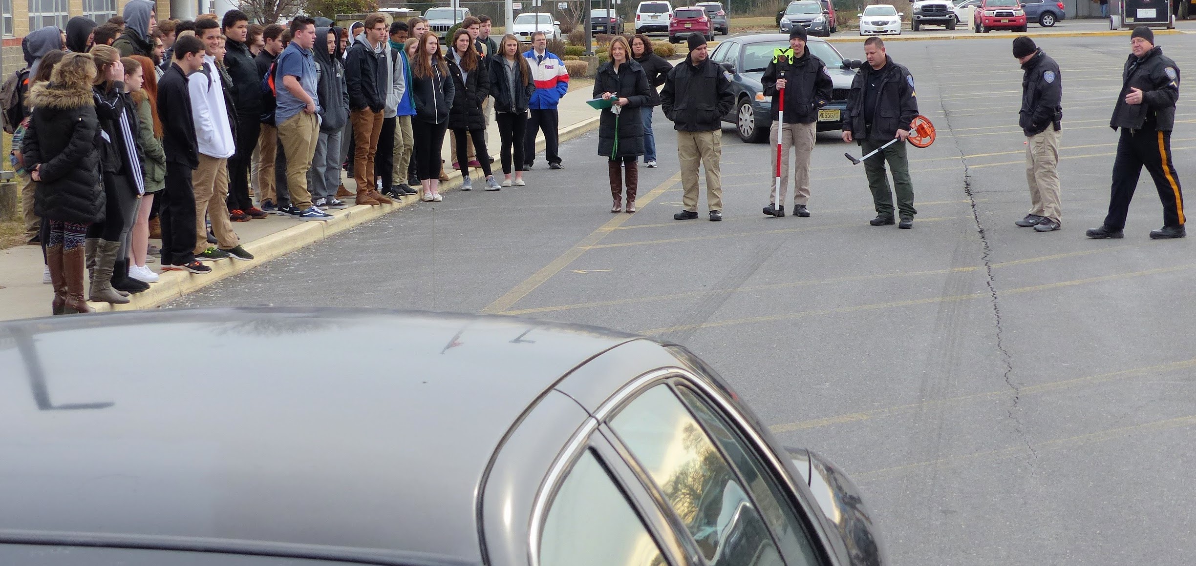 Crashed car and skid marks form basis for outside class in accident investigation for Middle Township High School students with the aid of Middle Township Police Department personnel Feb. 3.