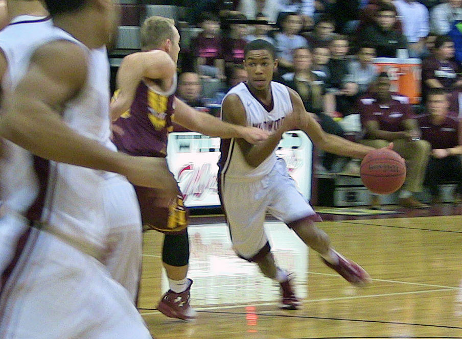 Wildwood High School’s Kyion Flanders dribbles past a Gloucester Catholic defender in Thursday’s home game against the Tri-County Conference rival. Flanders led the Warriors with a game-high 35 points and 10 rebounds in the team’s 71-64 win.