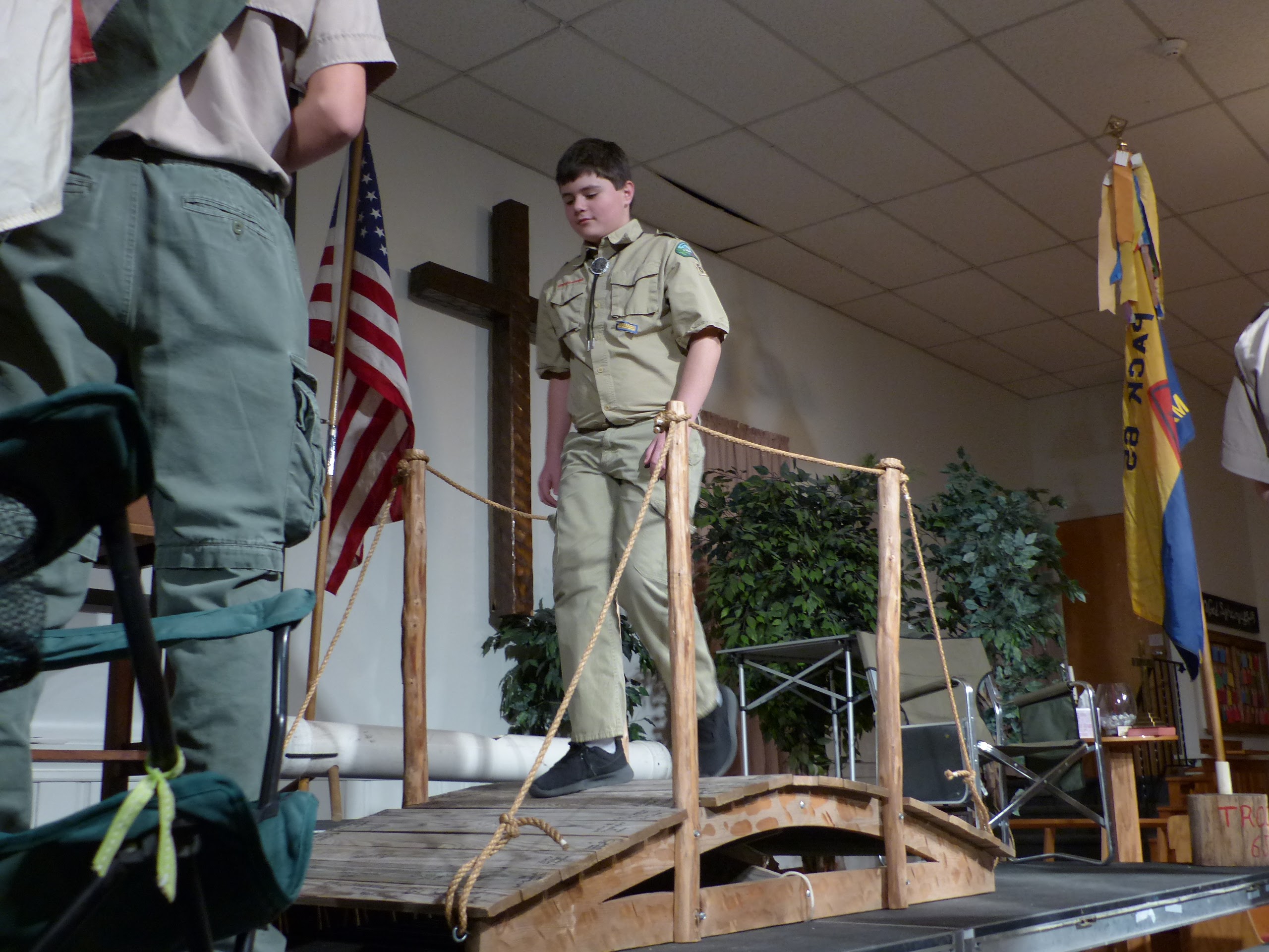 Robert Schaefer crosses bridge from Pack 65 to Troop 65