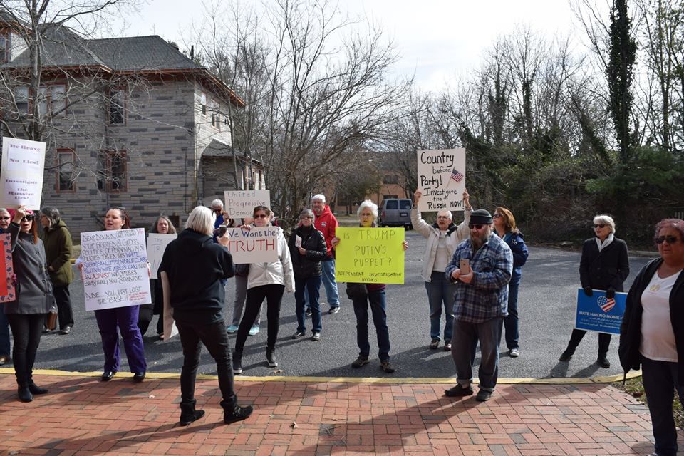 Protesters and members of the United Progressive Democrats demonstrate in front of the Mays Landing office of Congressman Frank LoBiondo