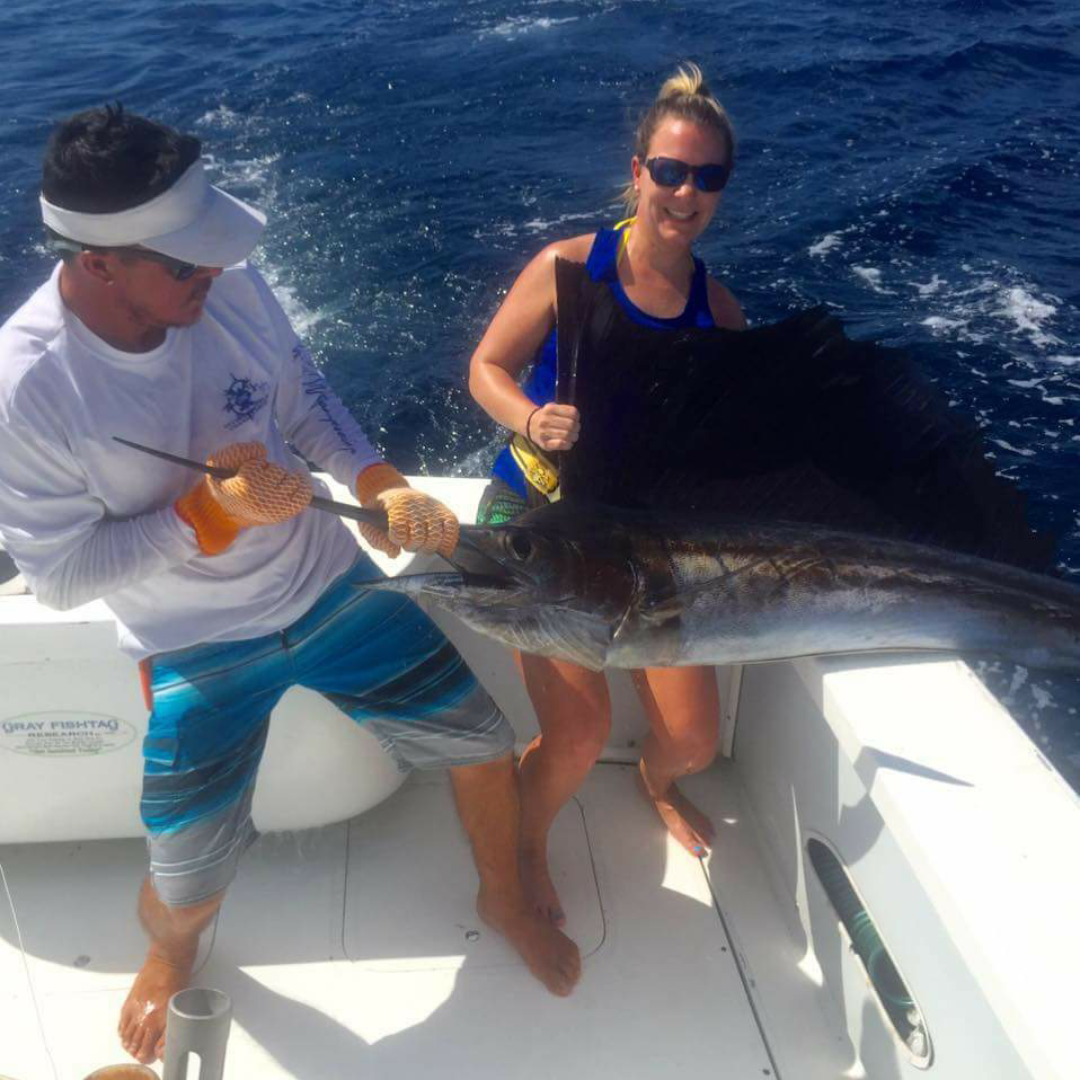 Brooke Sarter in Costa Rica and her “first ever caught” sailfish. 