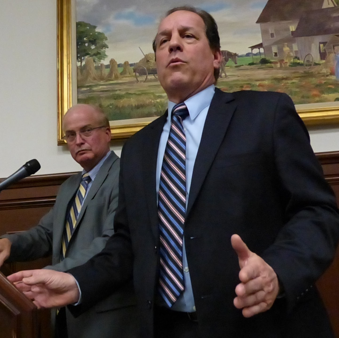 Warden Donald Lombardo of Cape May County Correctional Center explains procedures for incoming inmates to freeholders and public March 28. At left is Sheriff Gary Schaffer.