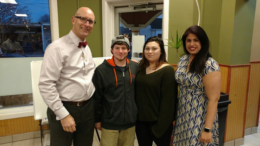 Dr. Christopher Zitnay and Dr. Anita Raghuwanshi of Cape Regional Health System pose with patient Nicholas Madden and Destiny Williams at Nemo’s Pizza in Stone Harbor