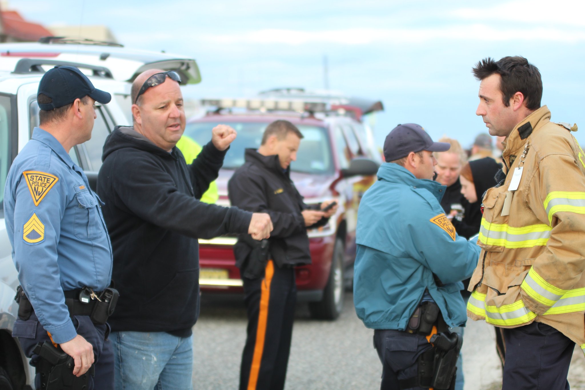 Police take a witness' statement in Cape May April 1.